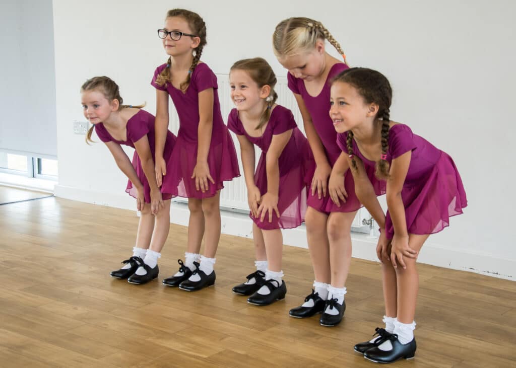 Children taking a bow after tap class